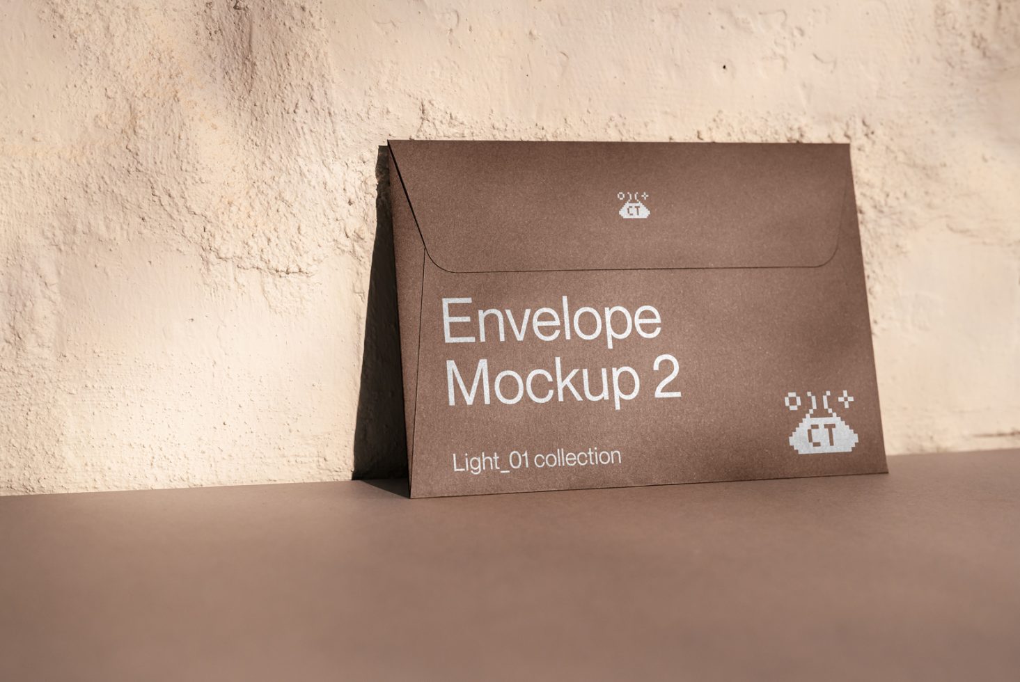 Brown envelope mockup with shadow on textured background, from the Light_01 collection, displaying design space for branding.